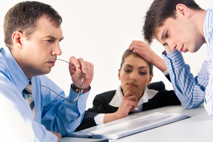 Image of three professionals thinking about business-plan